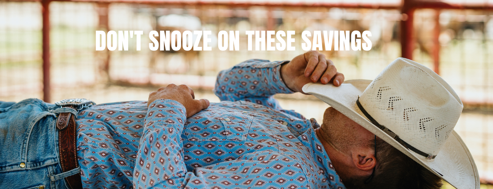 An image of a man laying down with a cowboy hat over his face with the words "don't snooze on these savings" above him.
