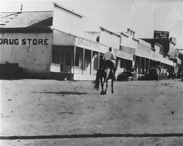 Guy on horse in old Sonora street